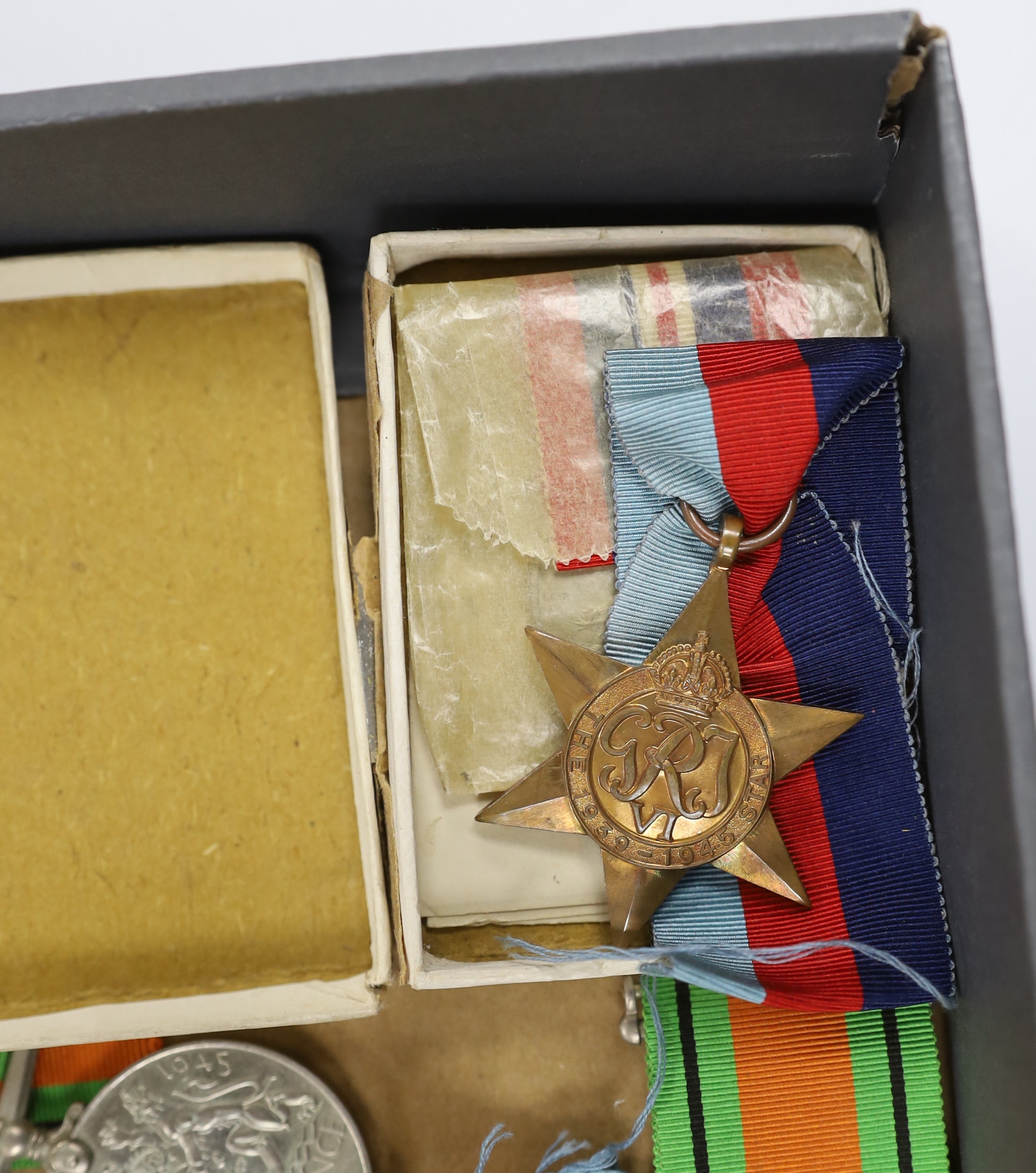 Fifteen WWII medals including some with original card boxes, including; eight War medals, three Defence medals and four 1939-1945 Stars